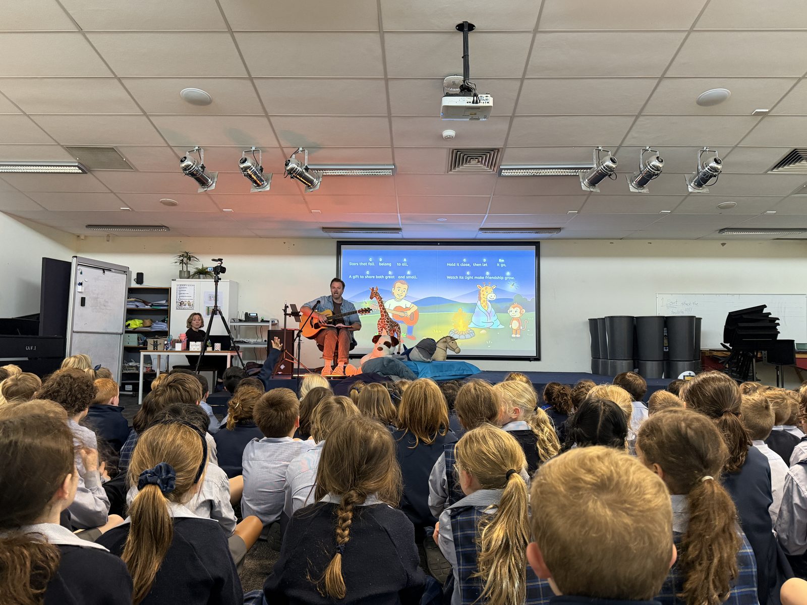 Children gathered for a One More Story classroom visit